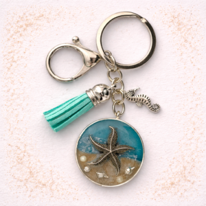 Isle of Wight resin keyring with real beach sand, starfish charm, seahorse and turquoise tassel