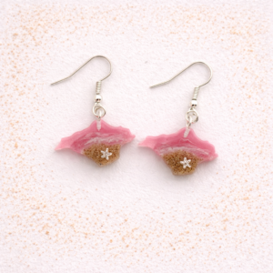 Pink resin Isle of Wight earrings with beach sand and starfish charm on silver hooks