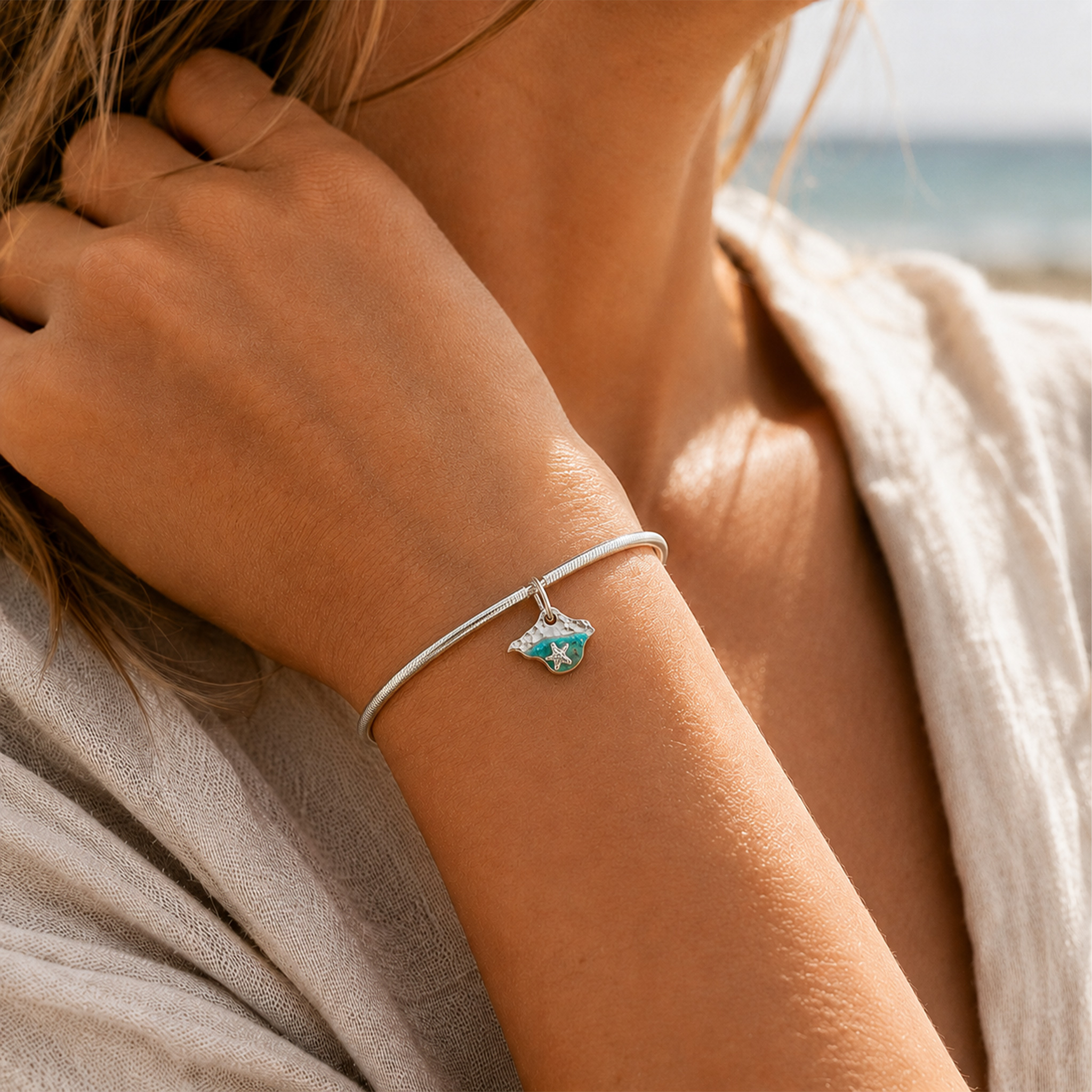 Isle of Wight charm in silver and resin worn on beach