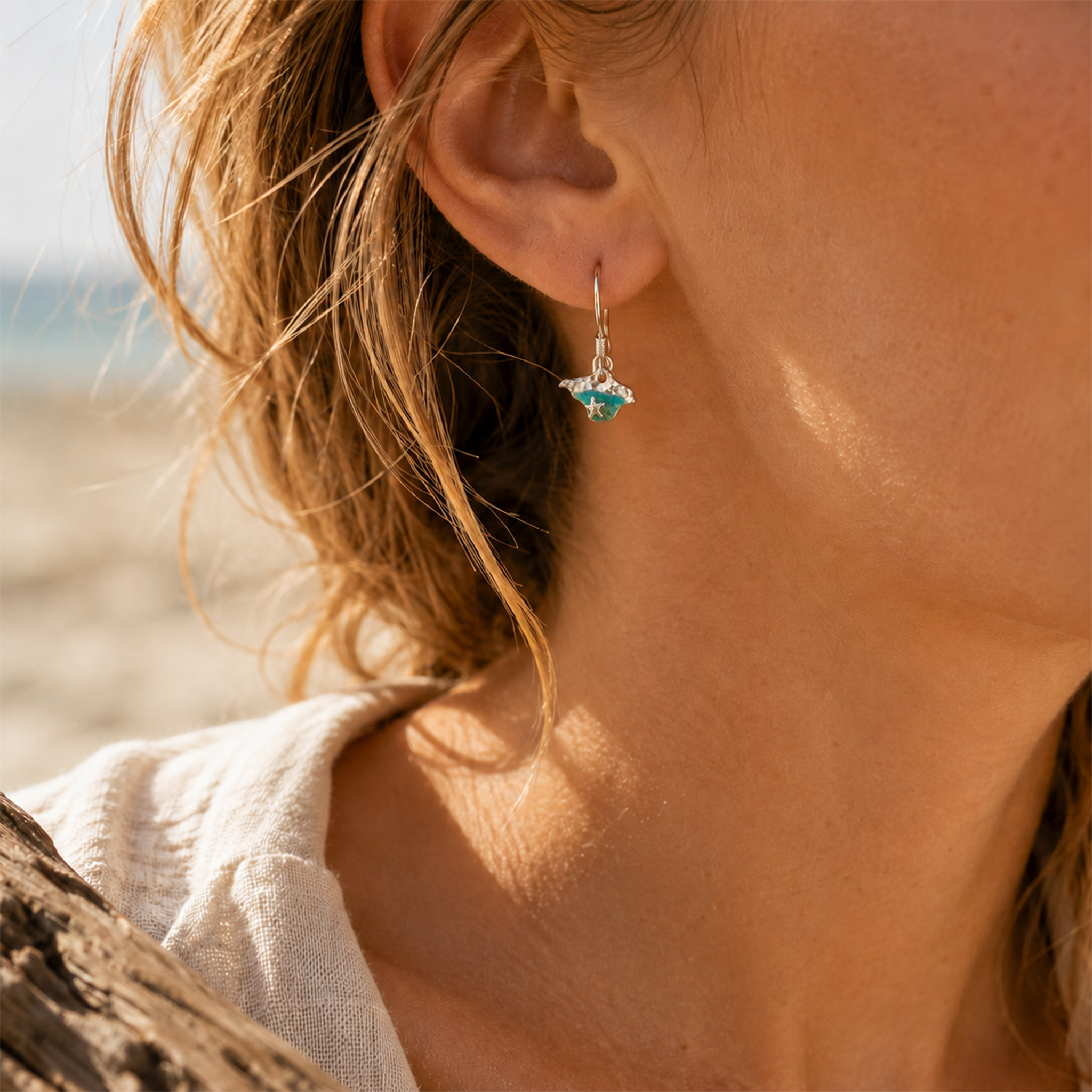 Isle of Wight silver and resin earrings worn on beach